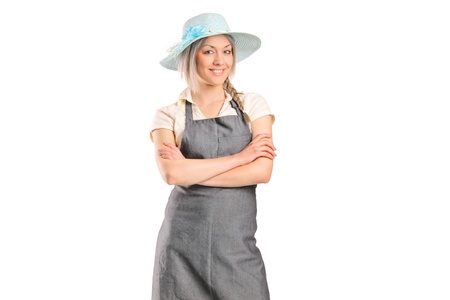 Portrait of a smiling female farmer with her hands crossed isolated on white backgroundの写真素材