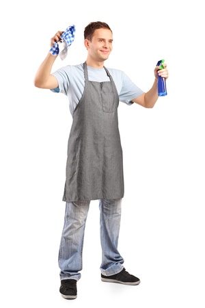Full length portrait of a young cleaner holding a cleaning supplies isolated on white backgroundの写真素材