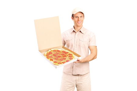 Delivery boy holding a pizza isolated on white backgroundの写真素材