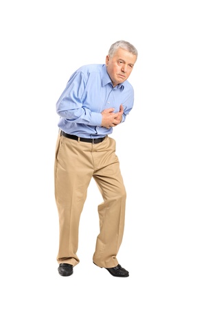Senior man having a heart attack isolated on white backgroundの写真素材