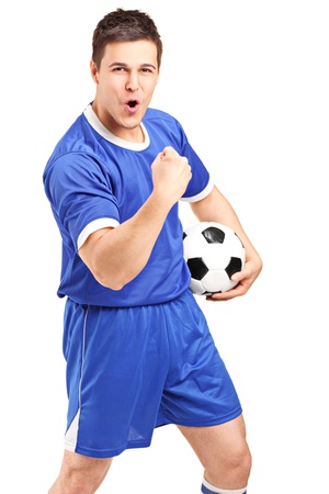 Excited sport fan holding a football and gesturing isolated on white backgroundの写真素材
