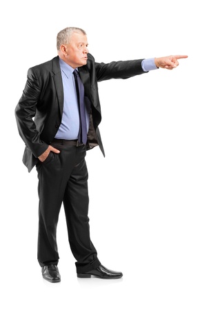 Full length portrait of an angry boss firing an employee isolated on white backgroundの写真素材