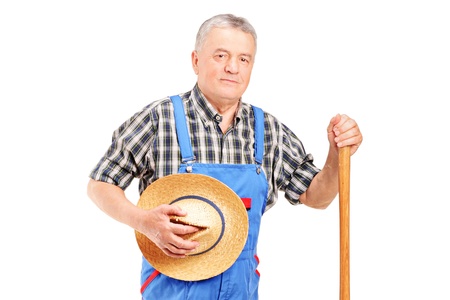 A mature farmer posing isolated on white backgroundの写真素材