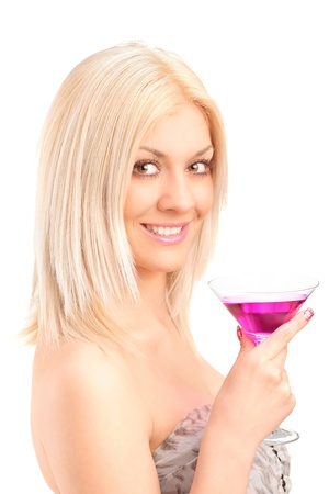 A beautiful woman drinking a cocktail isolated on white backgroundの写真素材