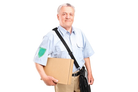 A mature postman delivering a box isolated on white backgroundの写真素材