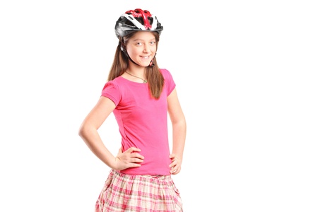 A portrait a happy girl wearing sport helmet isolated on white backgroundの写真素材
