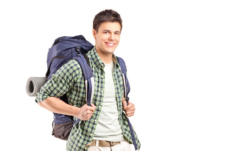 A portrait of a hiker with backpack posing isolated on white backgroundの写真素材