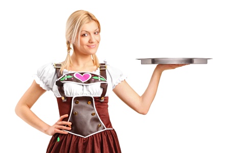 A portrait of a woman wearing traditional costume and holding an empty tray isolated on white backgroundの写真素材