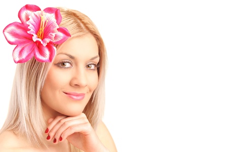Portrait of beautiful woman with flower in her hair isolated against white backgroundの写真素材