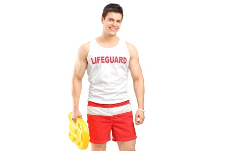 A smiling lifeguard on duty posing isolated on white background の写真素材