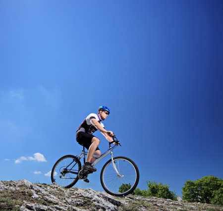 A man riding a mountain bike on a slope, Macedoniaの写真素材