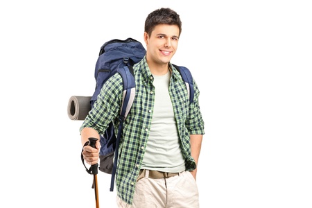 A hiker with backpack and hiking poles posingの写真素材