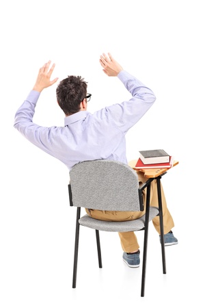 An afraid student sitting on a chair isolated on white backgroundの写真素材