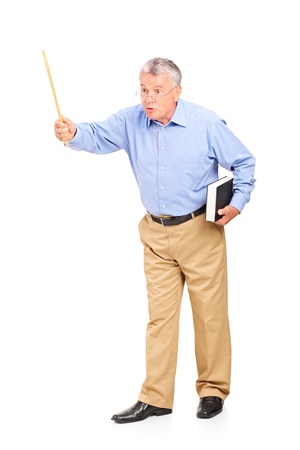 Full length portrait of an angry mature teacher holding a wand and gesturing isolated on white backgroundの写真素材