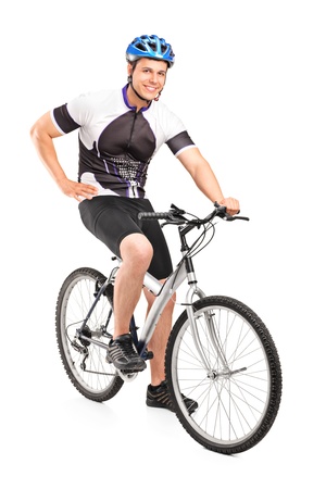 Male biker with helmet posing on a bike isolated against white backgroundの写真素材