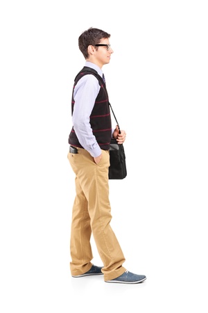 Full length portrait of a male student standing in line isolated against white backgroundの写真素材