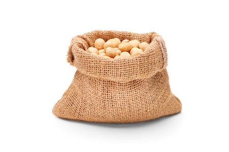 Hazelnuts in a bag, isolated on white backgroundの写真素材