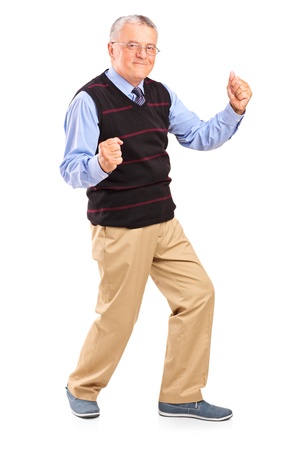 Full length portrait of a happy mature man, isolated on white backgroundの写真素材