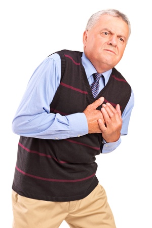 Mature man having a heart attack, isolated on white backgroundの写真素材