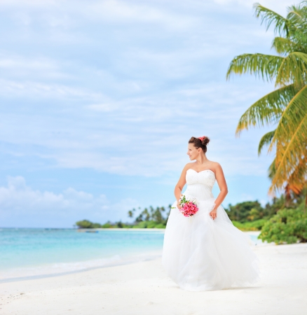 A bride on a beach in Kuredu resort, Maldives island, Lhaviyani atollの写真素材