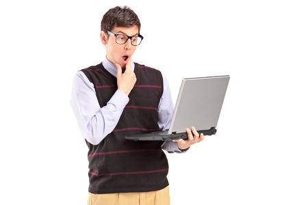 Young man holding a laptop and thinking isolated on white backgroundの写真素材