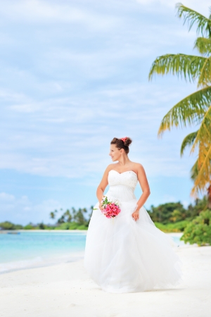 Young bride on a beach in Kuredu resort, Maldives island, Lhaviyani atollの写真素材