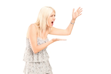Angry woman shouting isolated against white backgroundの写真素材