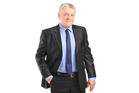 A serious mature businessman posing isolated against white backgroundの写真素材