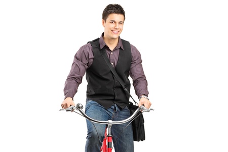 Studio shot of a man riding a bike isolated against white backgroundの写真素材