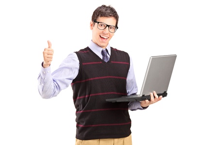Happy young man with laptop showing thumb up isolated on white backgroundの写真素材