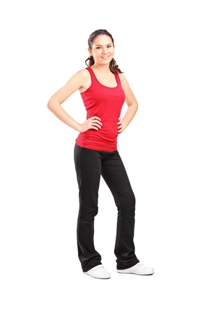 Full length portrait of a young athletic girl posing isolated on white backgroundの写真素材