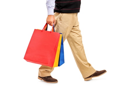 A man holding shopping bags isolated on white backgroundの写真素材