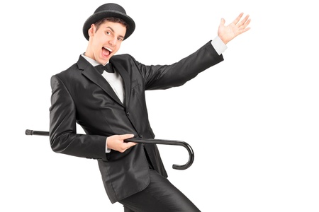 A performer dancing with a cane isolated on white backgroundの写真素材
