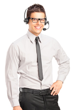 Handsome male customer service operator wearing a headset isolated on white backgroundの写真素材