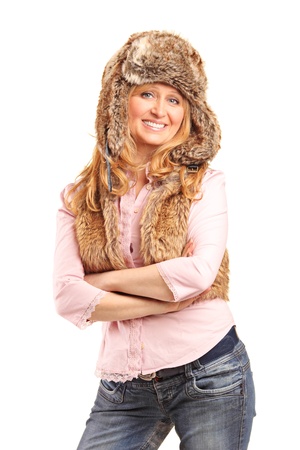 Beautiful smiling woman wearing fur hat isolated on white backgroundの写真素材