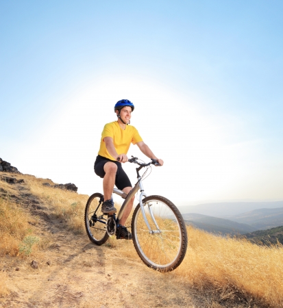 A biker riding a mountain bike on a dirty road, Macedoniaの写真素材