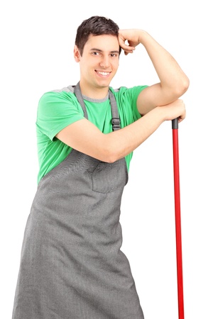 Smiling male cleaner posing isolated on white backgroundの写真素材