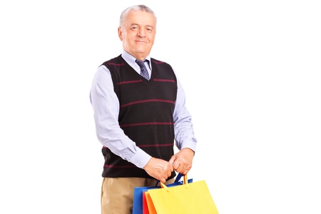 A gentleman holding shopping bags isolated on white backgroundの写真素材