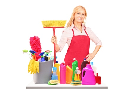 A female cleaner posing with cleaning equipment isolated against white backgroundの写真素材