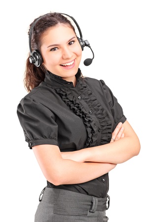 A smiling female customer support with headphones and microphone isolated on white backgroundの写真素材