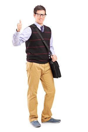 Full length portrait of a male student giving a thumb up isolated on white backgroundの写真素材