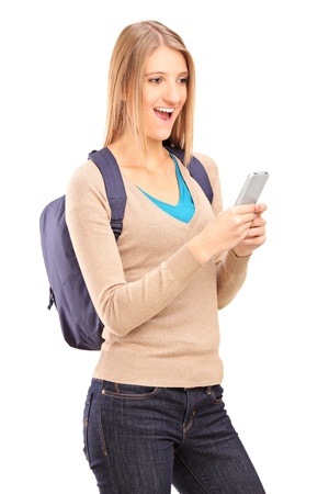 Excited female holding mobile phone isolated on white backgroundの写真素材