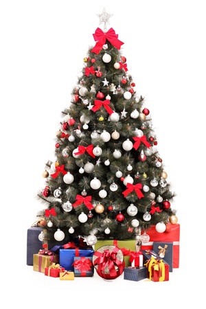 A studio shot of a decorated Christmas tree and gift boxes isolated on white backgroundの写真素材