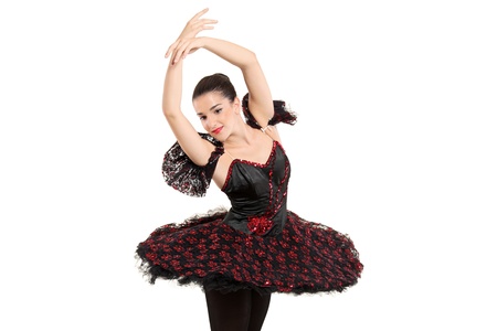 A ballerina dancer making a ballet posing against white backgroundの写真素材