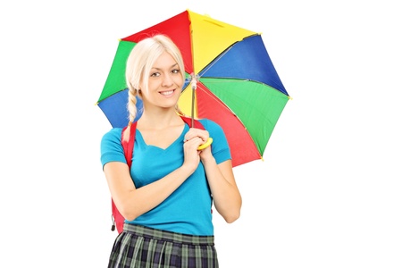 A female student holding an umbrella isolated against white backgroundの写真素材