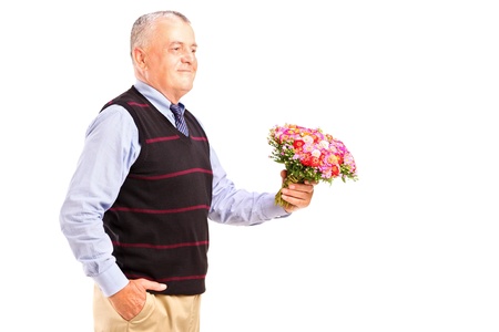 A gentleman holding a bunch of flowers isolated on white backgroundの写真素材