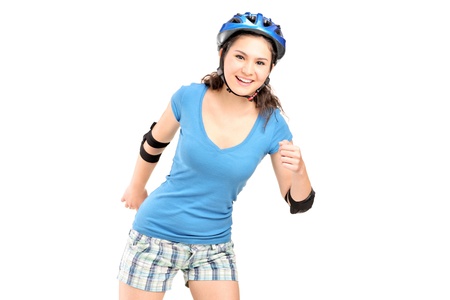 Female on rollers skating isolated on white backgroundの写真素材