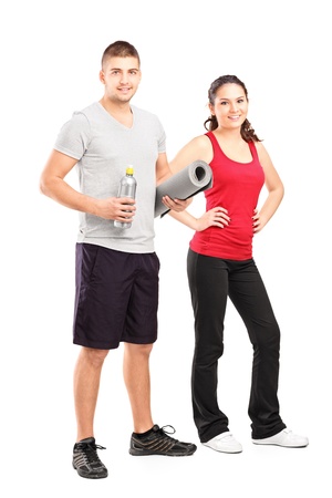 Full length portrait of a man and female athlete after an excerise isolated on white backgroundの写真素材