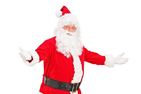 A happy Santa Claus gesturing welcome isolated against white backgroundの写真素材