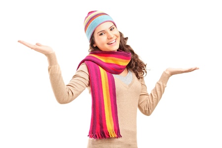 Young relaxed female gesturing with her hands isolated on white backgroundの写真素材